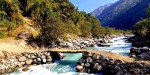  श्रमदान गरेर तमोर नदीमा काठे  पुल निर्माण